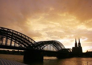 Cologne at dusk with Dom Cathedral spires in the background. (Michael Ozaki/The Epoch Times)