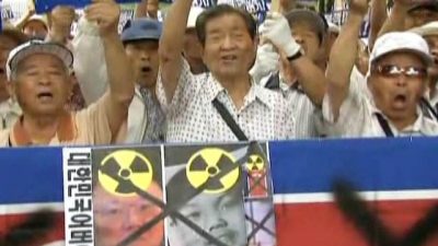 Koreans Protest Missile Launches and Kim Jong-il