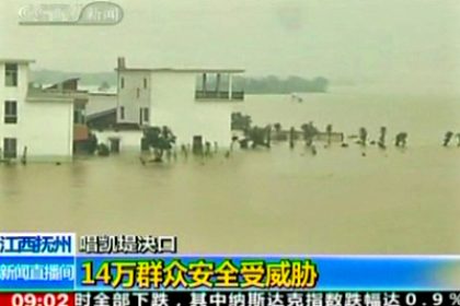 Flooded River Breaches Dyke in Southern China