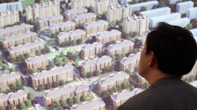 Chinesen fühlen den Druck von Immobilienpreisen