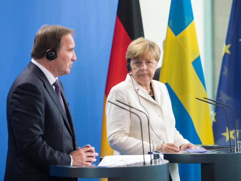 Merkel und Löfven für EU-Verteilungsschlüssel
