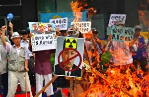 South Korean conservative activists set fire to a portrait of North Korean leader Kim Jong-Un during a protest denouncing North Korea's nuclear test in Seoul on September 10, 2016. South Korean newspapers sounded the alarm on September 10 over what one termed the &quot;nuclear maniac&quot; Kim Jong-Un, saying the North Korean leader's fifth and biggest nuclear test is a game-changer demanding a tougher response. / AFP / JUNG YEON-JE (Photo credit should read JUNG YEON-JE/AFP/Getty Images)
