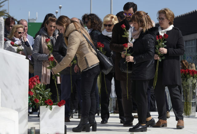 Relatives of the victims of the Germanwings crash display flowers in front of the commemorative plaque set for the victims of the Germanwings plane which crashed into the French Alps and claimed 150 lives, at Barcelona's airport, in El Prat de Llobregat on March 23, 2017. The father of a Germanwings co-pilot whose plane slammed into the Alps in 2015 is trying to prove his son did not crash the jet deliberately, sparking anger among victims' families. The crash killed all 144 passengers and six crew -- a group of people from 20 countries, among them 72 Germans and 50 Spaniards, heading back from Barcelona and bound for Duesseldorf airport. / AFP PHOTO / LLUIS GENE (Photo credit should read LLUIS GENE/AFP/Getty Images)