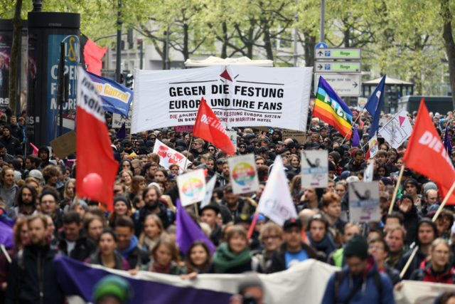 COLOGNE, GERMANY - APRIL 22: Protesters demonstrating against the right-wing populist Alternative for Germany (AfD) political party federal congress on April 22, 2017 in Cologne, Germany. Up to 50,000 people were expected to participate in the protests against the AfD, which is holding its federal congress of delegates following the recent surprise announcement by its chairwoman Frauke Petry that she will not run in German federal elections scheduled for September. The AfD saw a surge in popularity that helped it capture seats in 10 state parliaments, though more recently that party has seen its poll numbers slip. It has also been plagued by infighting between more moderate and radical factions of its leadership. (Photo by Lukas Schulze/Getty Images)