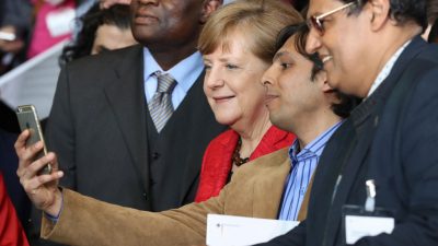 Merkel würdigt Arbeit von ehrenamtlichen Flüchtlingshelfern – Monatlich kommen rund 14.000 neue Flüchtlinge