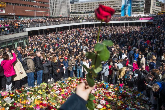 People attend a memorial ceremony on April 9, 2017 at Sergels Torg plaza in Stockholm, close to the point where a truck drove into a department store two days before. Four people died and fifteen were injured when a truck plunged into a crowd at a busy pedestrian street in the Swedish capital on April 7, 2017. / AFP PHOTO / Odd ANDERSEN / ALTERNATIVE CROP (Photo credit should read ODD ANDERSEN/AFP/Getty Images)