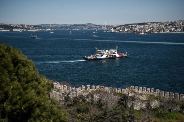 Ferry boats cross the Bosphorus Strait off Istanbul on April 3, 2017. / AFP PHOTO / OZAN KOSE (Photo credit should read OZAN KOSE/AFP/Getty Images)