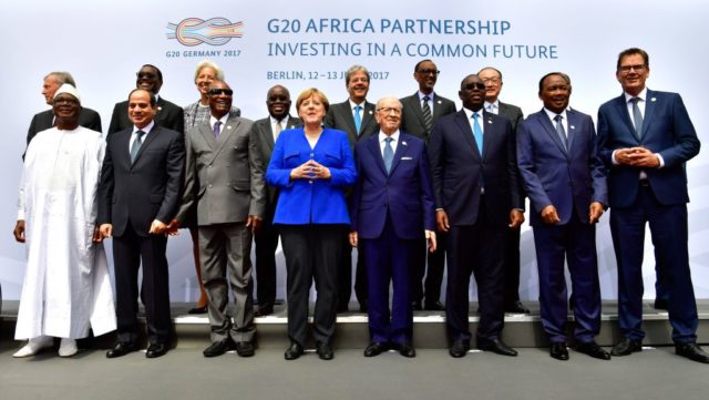 (1st row L-R) Malian President Ibrahim Boubacar Keita,Egyptian President Abdel Fattah al-Sisi, Guinean President and Chairman of the African Union Alpha Conde, German Chancellor Angela Merkel, Tunesian President Beji Caid Essebsi, Senegalese President Macky Sall ; (2nd row L-R) former German President Horst Koehler, the President of the African Development Bank Akinwumi Adesina, the Managing Director of the International Monetary Fund Christine Lagarde, Ghanaian President Nana Akufo Addo, Italy's Prime Minister Paolo Gentiloni, Rwandan President Paul Kagame, the President of the World Bank Group Jim Yong Kim, Ivorian President Alassane Ouattara an Chairman of the African Union Commission Moussa Faki pose for a family picture during a two-day G20 Africa partnership investment conference in Berlin on June 12, 2017. / AFP PHOTO / John MACDOUGALL (Photo credit should read JOHN MACDOUGALL/AFP/Getty Images)