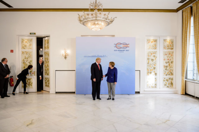 HAMBURG, GERMANY - JULY 06: German Chancellor Angela Merkel receives U.S. President Donald Trump in the Hotel Atlantic, on the eve of the G20 summit, for bilateral talks on July 6, 2017 in Hamburg, Germany. Leaders of the G20 group of nations are meeting for the July 7-8 summit. Topics high on the agenda for the summit include climate policy and development programs for African economies. (Photo by Jens Schluter - Pool/Getty Images)