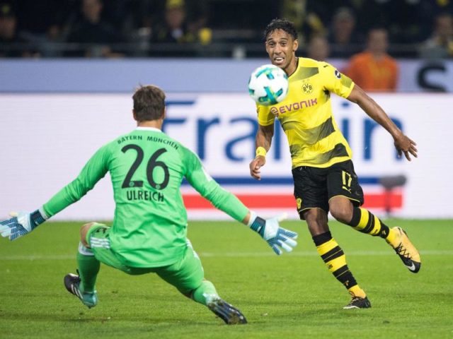 Der Dortmunder Toptorjäger schlenzte mit dem rechten Fuß den Ball ins Tor. Foto: Marius Becker/dpa