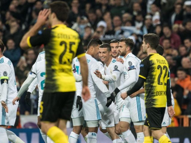 Cristiano Ronaldo (M) lässt sich für sein Tor feiern - die BVB-Spieler sind frustriert. Foto: Bernd Thissen/dpa