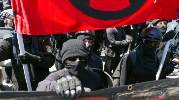 Antifa members and counter protesters gather during a rightwing No-To-Marxism rally on August 27, 2017 at Martin Luther King Jr. Park in Berkeley, California. (Photo by Amy Osborne / AFP) (Photo by AMY OSBORNE/AFP via Getty Images)