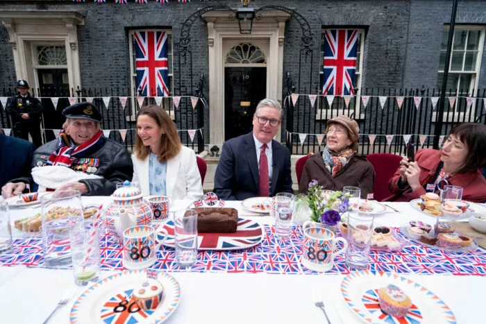 Britain's Prime Minister Keir Starmer alongside his wife Victoria Starmer host a street party in Downing Street on May 5, 2025 to celebrate the 80th anniversary of VE Day also known as Victory in Europe Day, marking the end of the Second World War in Europe. (Photo by Stefan Rousseau / POOL / AFP) (Photo by STEFAN ROUSSEAU/POOL/AFP via Getty Images)