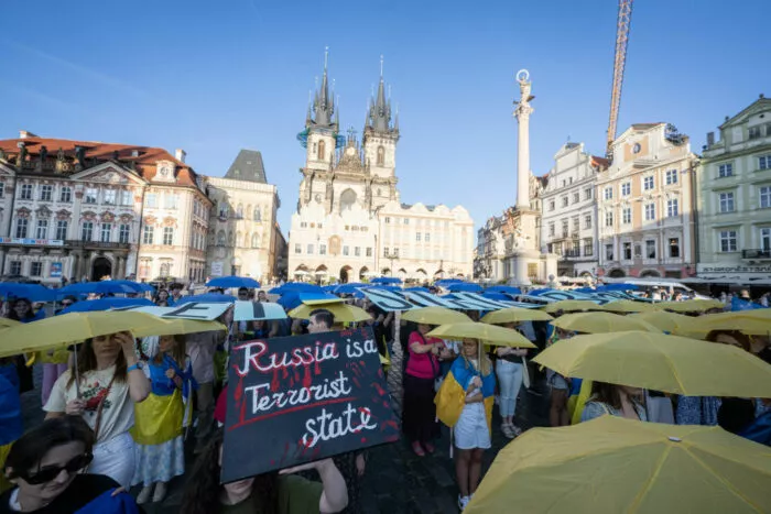 Demonstrators hold yellow and blue umbrellas as they protest against Russia's war in Ukraine and demand the support for efficient air defense for Ukraine, on September 7, 2024 in Prague, Czech Republic. (Photo by Michal Cizek / AFP) (Photo by MICHAL CIZEK/AFP via Getty Images)