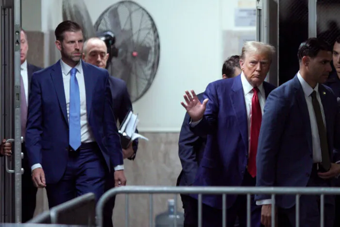 NEW YORK, NEW YORK - APRIL 30: Former U.S. President Donald Trump walks into court along with his son Eric Trump (L) during his trial for allegedly covering up hush money payments at Manhattan Criminal Court on April 30, 2024 in New York City. Former U.S. President Donald Trump faces 34 felony counts of falsifying business records in the first of his criminal cases to go to trial. (Photo by Eduardo Munoz-Pool/Getty Images)