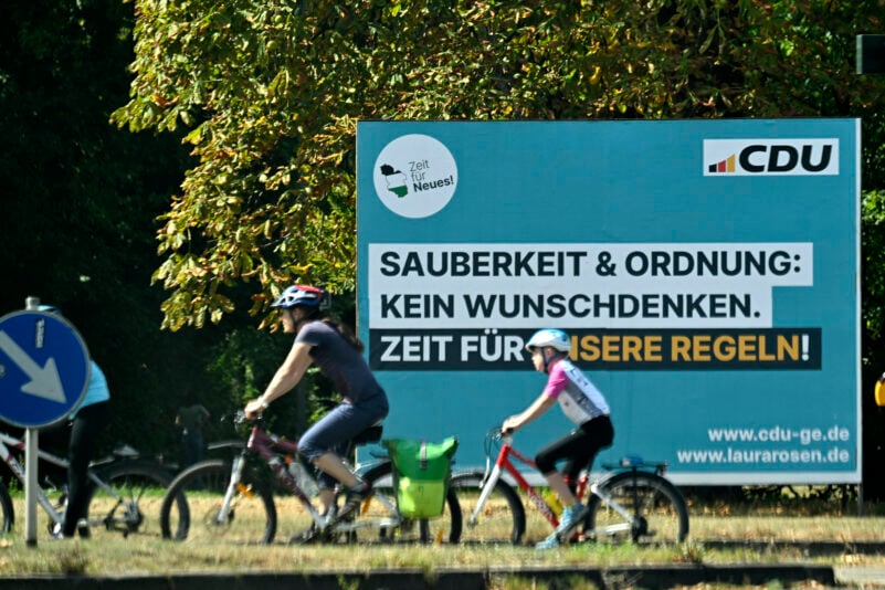 An election campaign placard of Germany's conservative Christian Democratic Union (CDU) party reads 'Cleanliness and tidiness: not just wishful thinking. Time for our rules!', in Schalke district, Gelsenkirchen, western Germany on August 27, 2025. On 14 September 2025, local elections will be held in North Rhine-Westphalia, Germany's most populous federal state. The election is expected to see gains for the AfD, a party with extreme right-wing elements in some parts, in the SPD's only stronghold. (Photo by Ina FASSBENDER / AFP) (Photo by INA FASSBENDER/AFP via Getty Images)