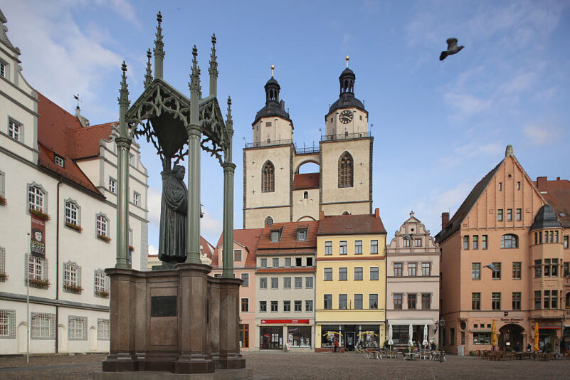 WITTENBERG, GERMANY - OCTOBER 20: A statue of 16th-century theologian Martin Luther stands on Marktplatz square near the Stadtkirche Sankt Marien church, where nearly 500 years before Luther led the first vernacular mass, on October 20, 2016 in Wittenberg, Germany. In 1517 Luther nailed his 95 theses to a door of the nearby Schlosskirche Church. Next year will mark the 500th anniversary of the Reformation that Luther set in motion and that led to the creation of successful Protestant movements in history's most significant challenge to the Catholic Church. Celebrations and events in Germany will begin later this month and continue globally through next year. Luther's translation of the Bible made it accessible to a much broader audience. He also spoke out against the practice of indulgences and the sale of relics, and also argued that a place in Heaven is possible not by good deeds but through faith. (Photo by Sean Gallup/Getty Images)